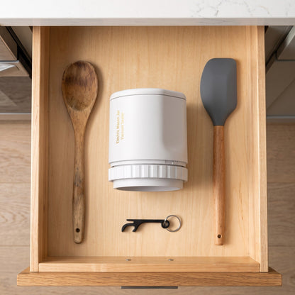 The sealer stored in a kitchen drawer with the keychain opener